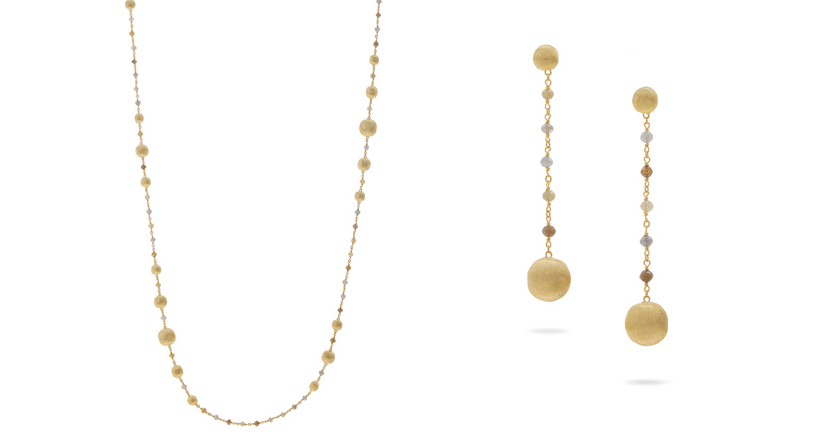 Hier: Collier und Ohrschmuck in 18 Karat Gelbgold mit afrikanischen Diamanten unregelmäßig geschliffen.