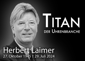 Schwarz-weißes Portraitfoto von Herbert Laimer, einem bedeutenden Akteur in der Uhrenbranche. Der Text im Bild lautet: "Titan der Uhrenbranche" und "Herbert Laimer, 27. Oktober 1945 † 29. Juli 2024". Herbert Laimer trägt einen Anzug und lächelt freundlich in die Kamera. Der Hintergrund ist dunkel, wodurch das Bild und der Text besonders hervorgehoben werden.
